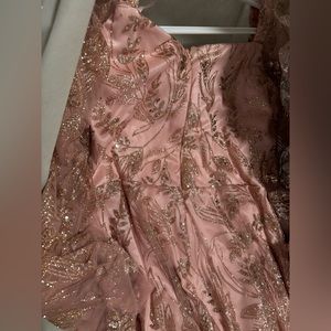 Used like new Beautiful pink and gold gown, size 12.